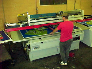 process colors being applied one at a time on a large formate press